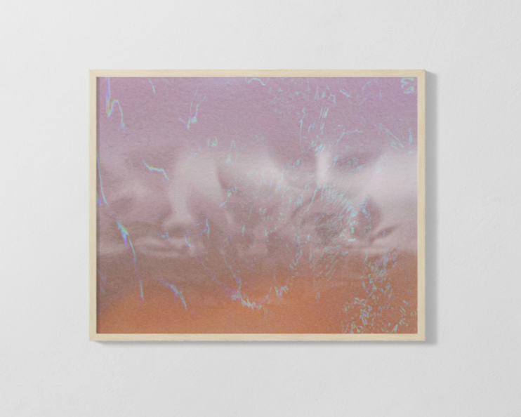 Framed artwork with abstract design on a white wall