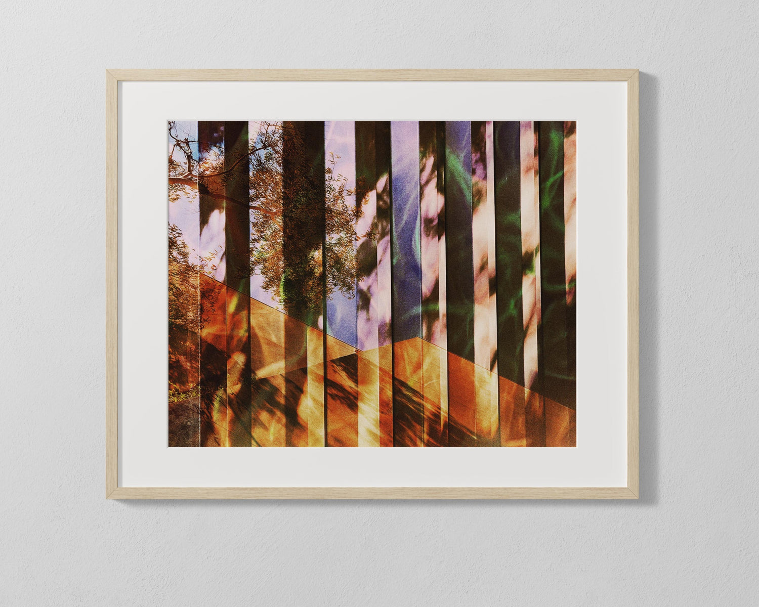Framed artwork with a colorful abstract design on a gray wall