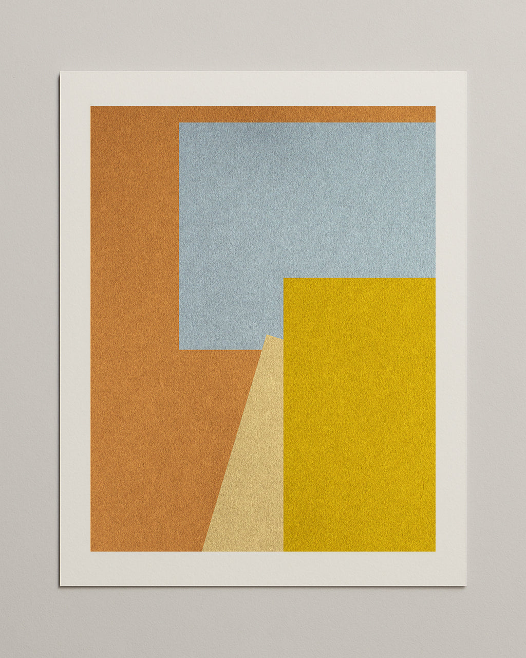 Framed abstract art print with geometric shapes in brown, blue, and yellow on a gray background