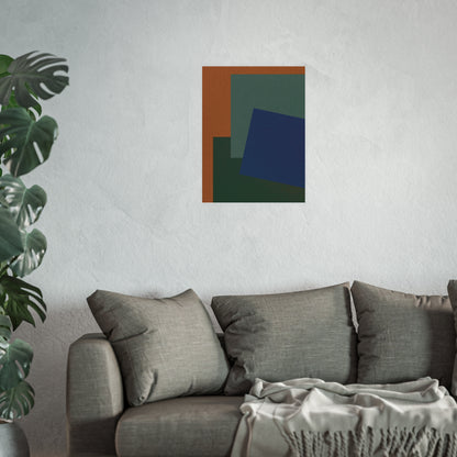 Abstract art piece on a wall above a sofa with a plant to the left.