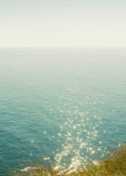 Minimalist ocean photography print with sunlight sparkling on the Pacific near the California coast — fine art wall decor by Niqui Carter.