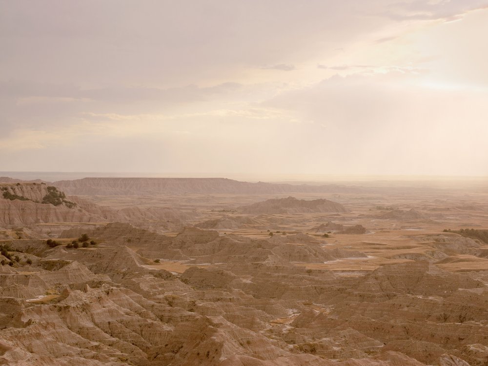 The Badlands landscape fine art photography print by Niqui Carter, warm earth tones desert terrain