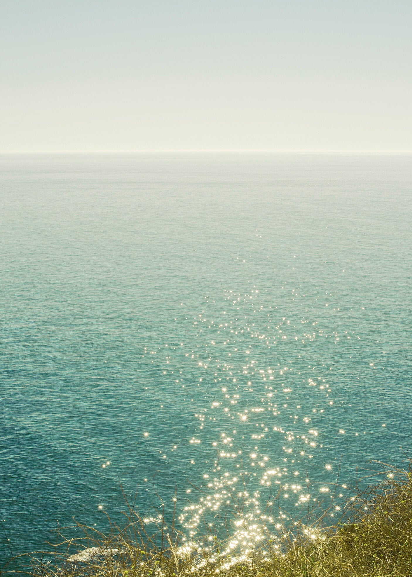 Serene seascape photography print by Niqui Carter, silver and teal ocean light 