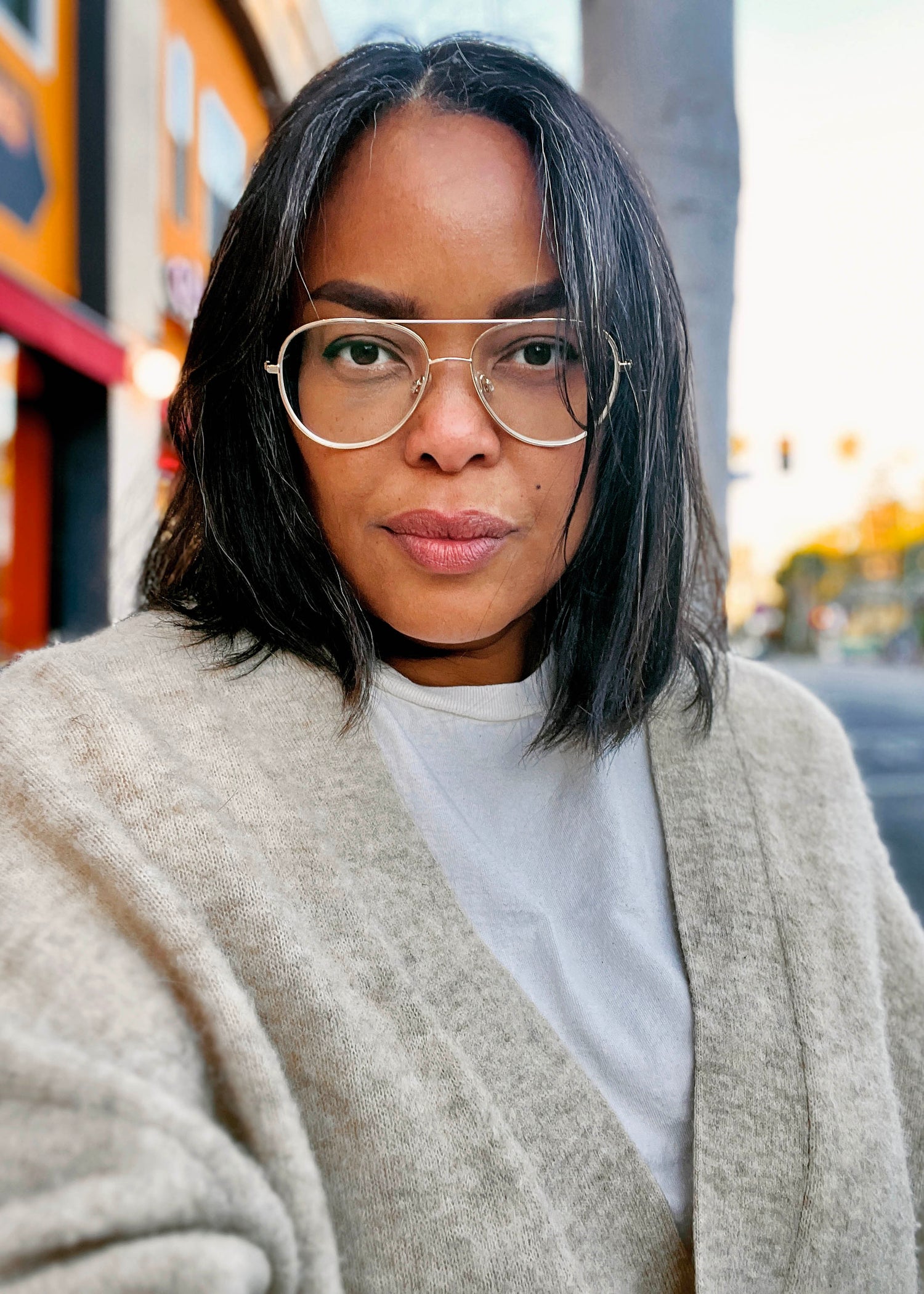 Niqui Carter wearing glasses standing on the sidewalk in the silverlake neighborhood of Los Angeles