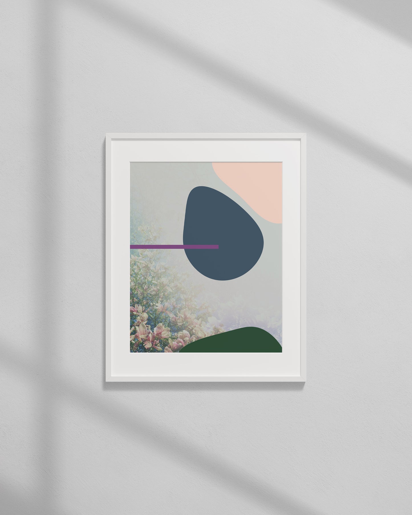 Framed abstract art print on a wall with soft shadows