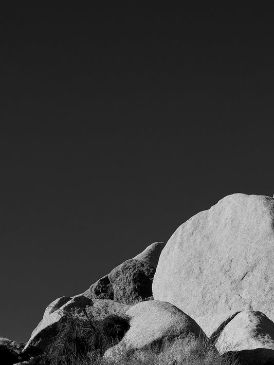 Large rocks against a black background at Joshua Tree National Park