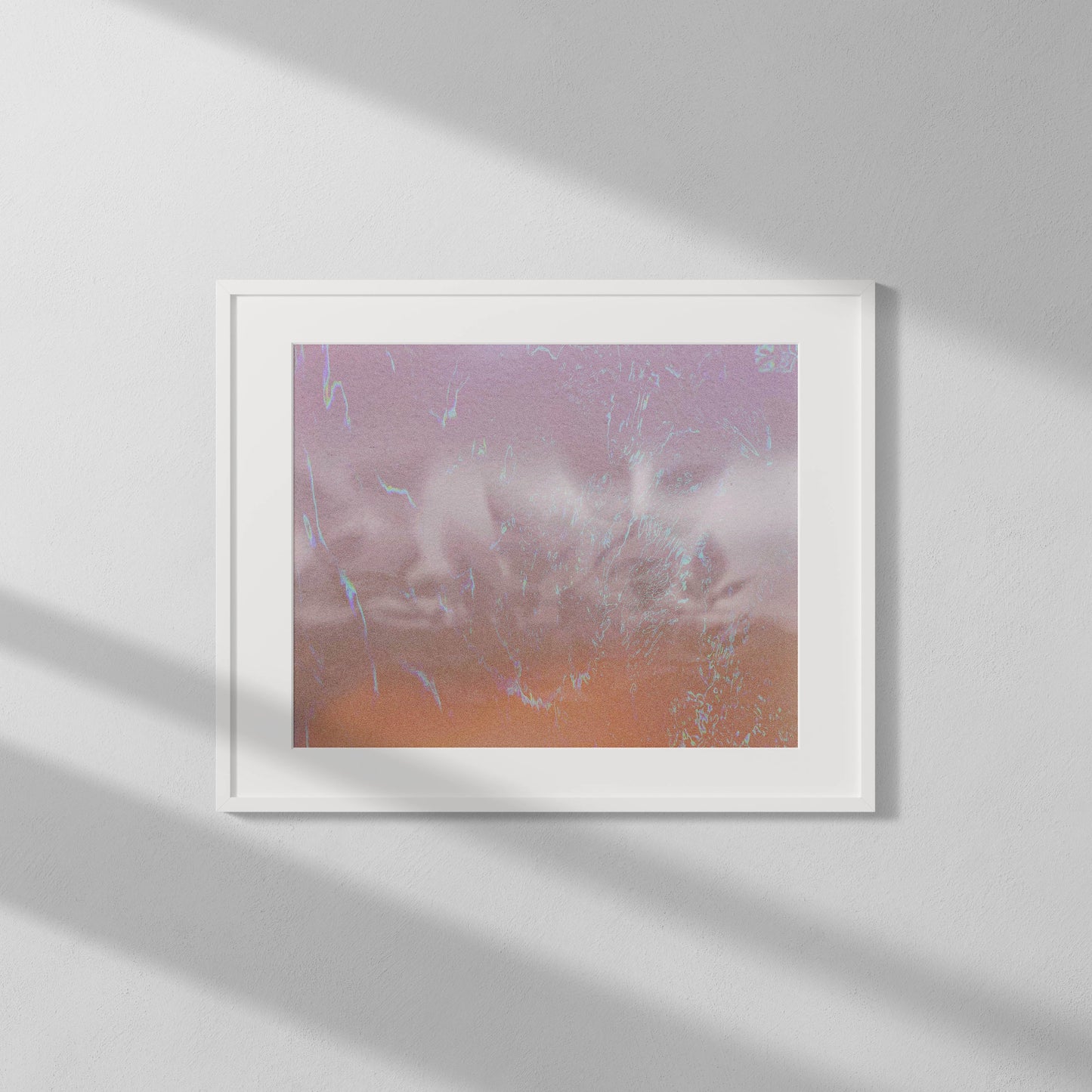 Framed artwork with a abstract design on a white wall