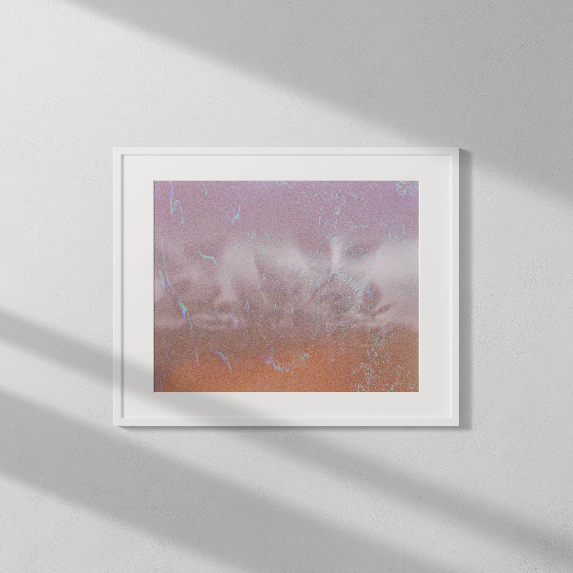 Framed artwork with a abstract design on a white wall
